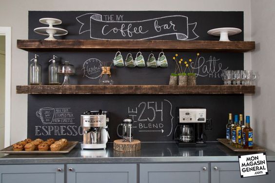 Fixer Upper Hosts Chip and Joanna Gaines transformed the casual dining space off the kitchen into the Ivy Family Coffee Bar, a place for family and friends to gather for eating and entertaining.  Chalk board paint on the wall creates a café-like atmosphere.  New cabinets offer plenty of storage, and the floating shelves correspond with the wood support beams in the open-concept living area, as seen on HGTV’s Fixer Upper.  (detail)