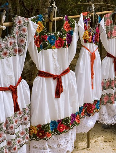 Colorful hand made clothing at outdoor Mayan marketplace